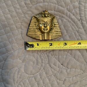 Brass pharaoh belt buckle.